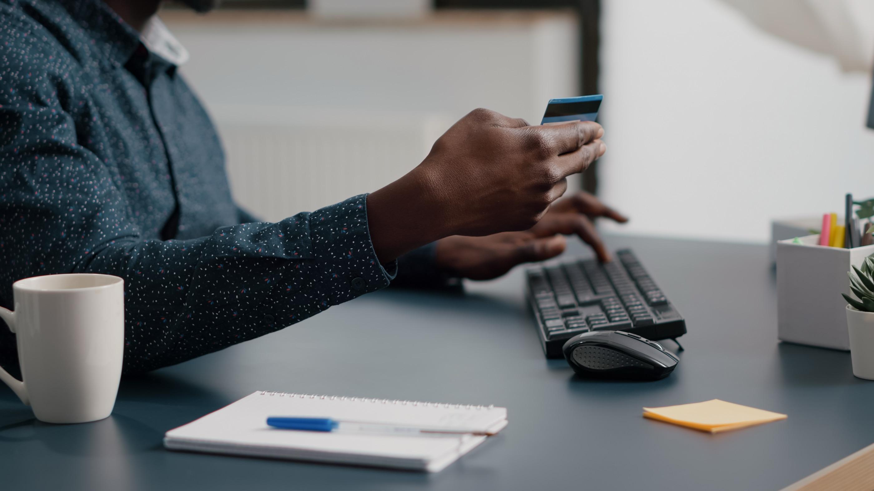 Customer entering card details on a keyboard
