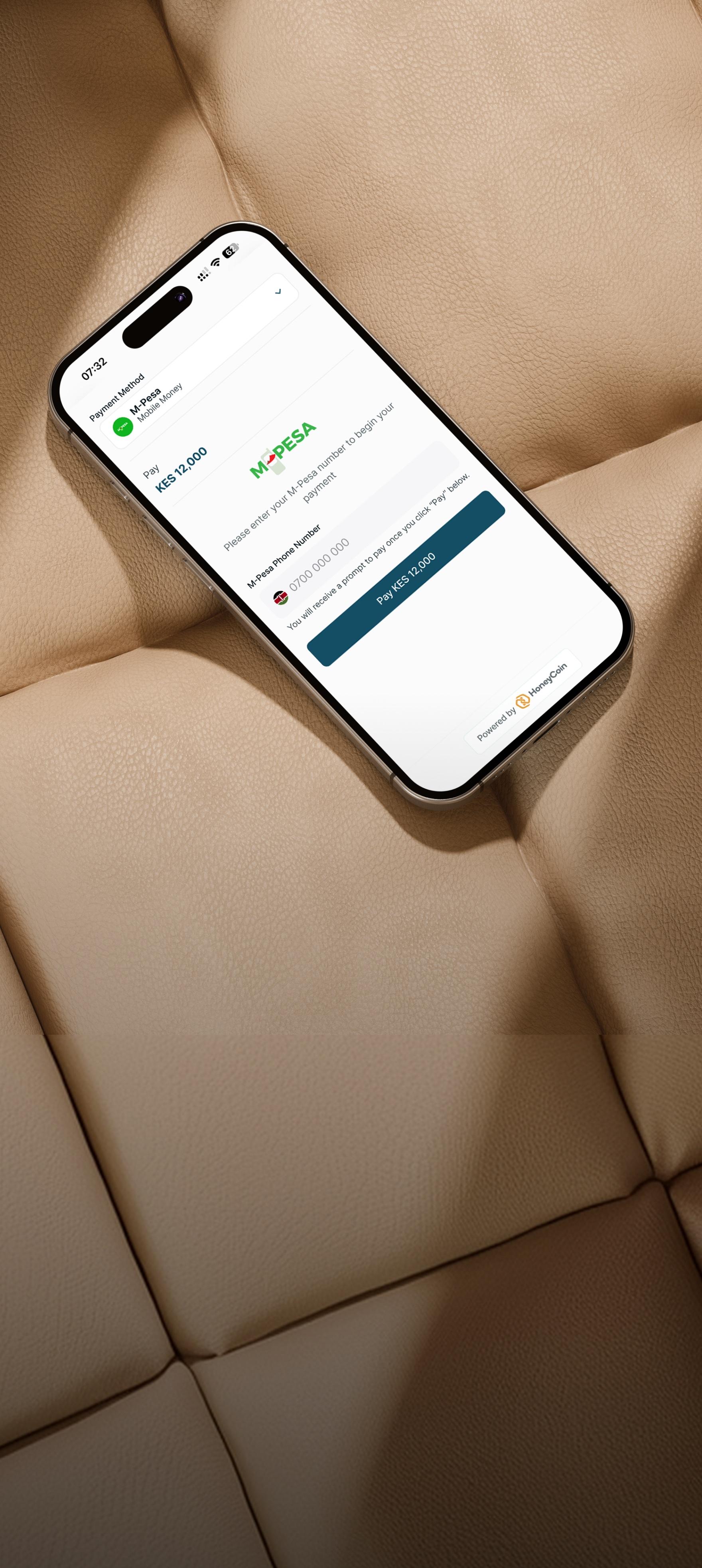Phone showing Cashless card payment on a leather surface