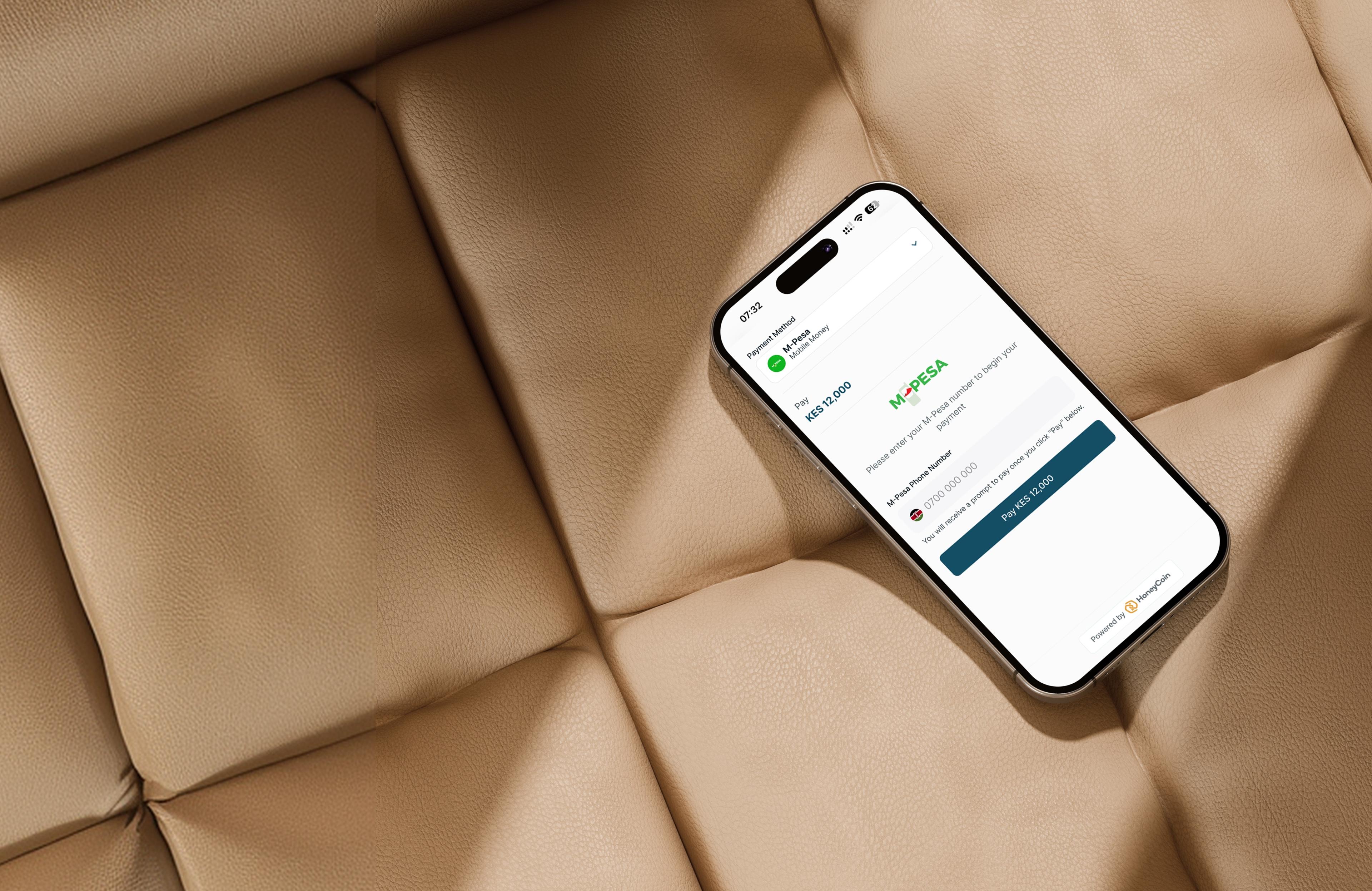 Phone showing Cashless card payment on a leather surface