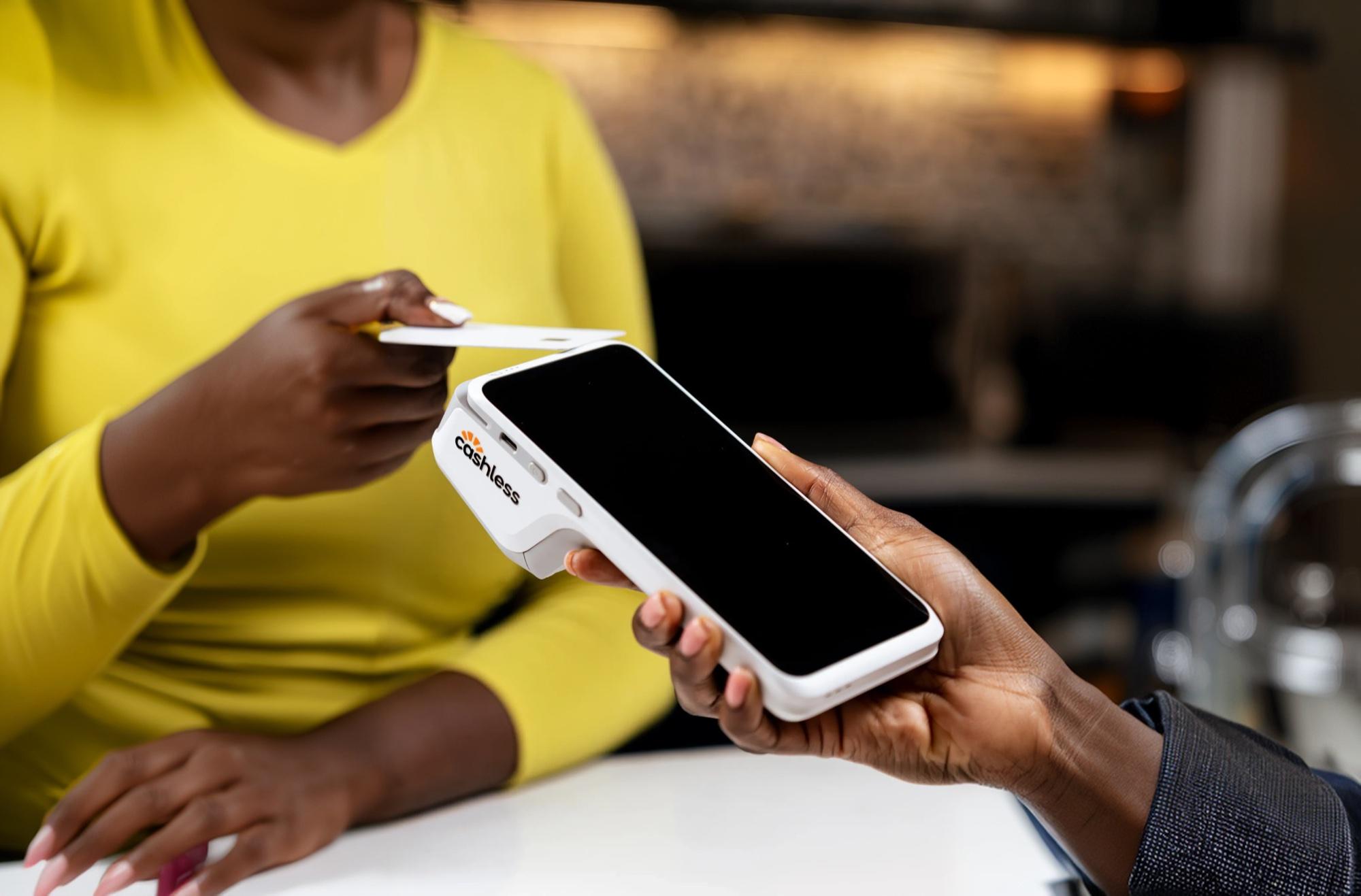Customer tapping a card on Cashless Plus
