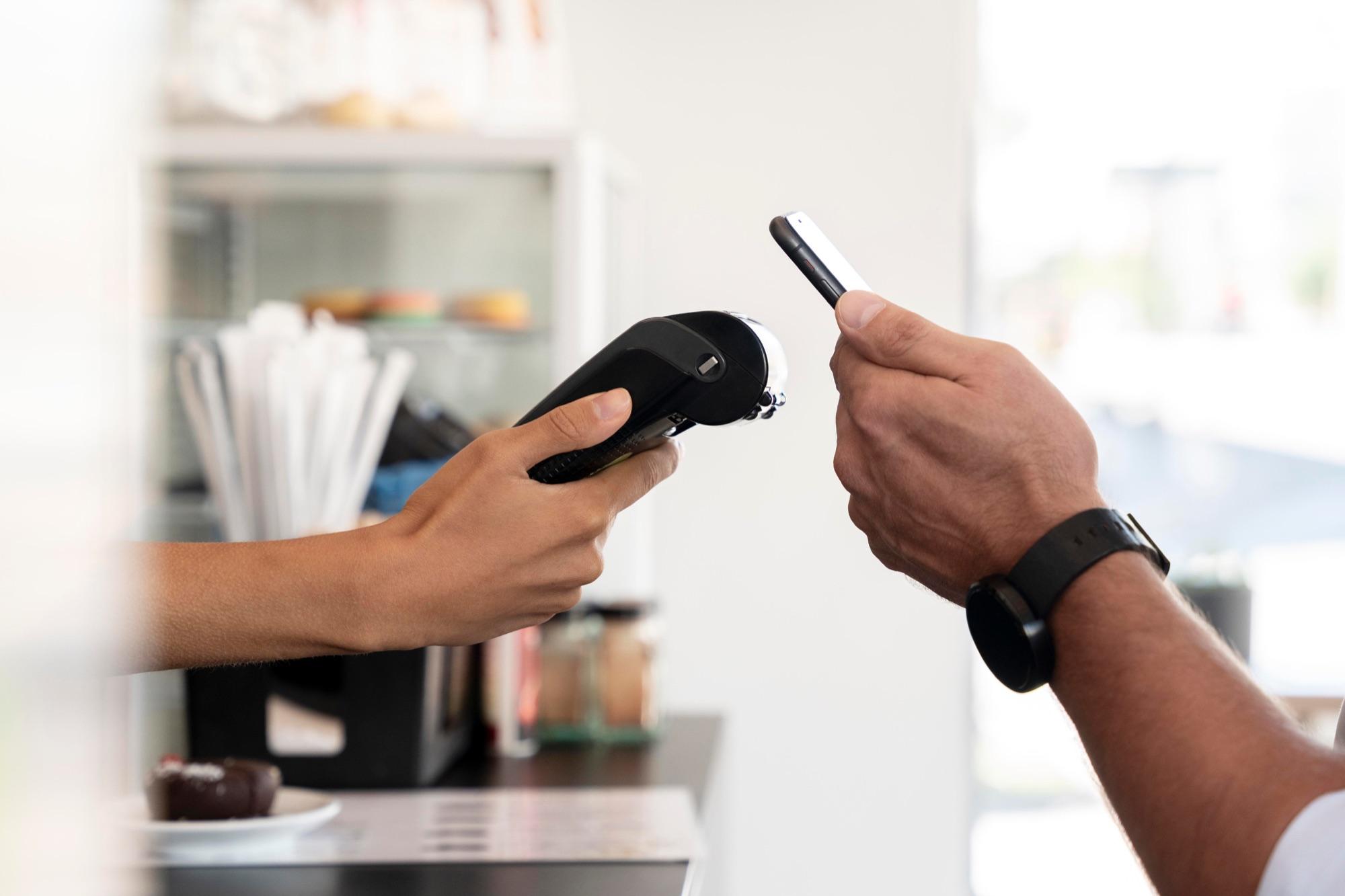 Contactless phone payment on a handheld Cashless Pro terminal